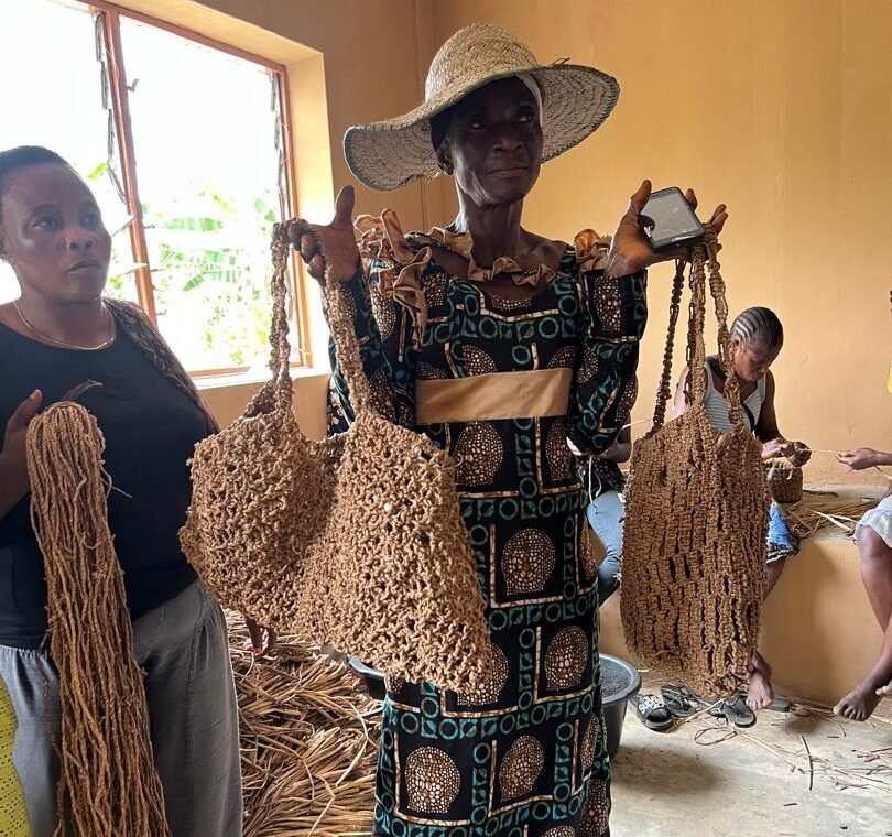 Mrs Adenike Charles of Ejirin with her finished water hyacinth products