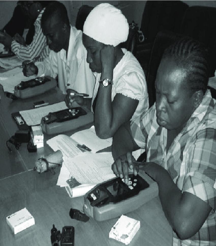 NAFDAC officials using the QR code