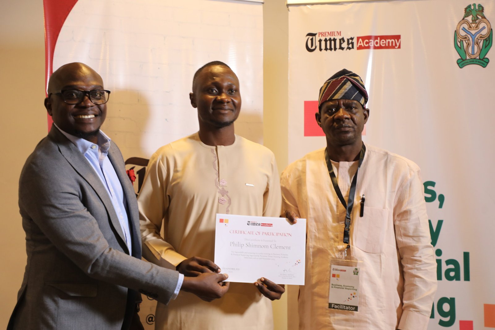 Participant being awarded certificate at the training [PHOTO CREDIT: PREMIUM TIMES]
