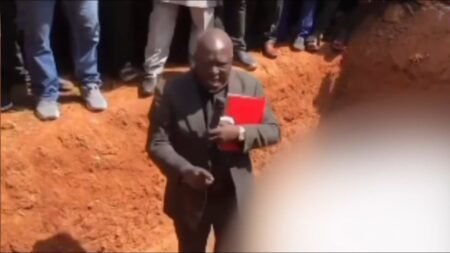 Nigerian pastor stands in mass grave of Christians while denouncing government