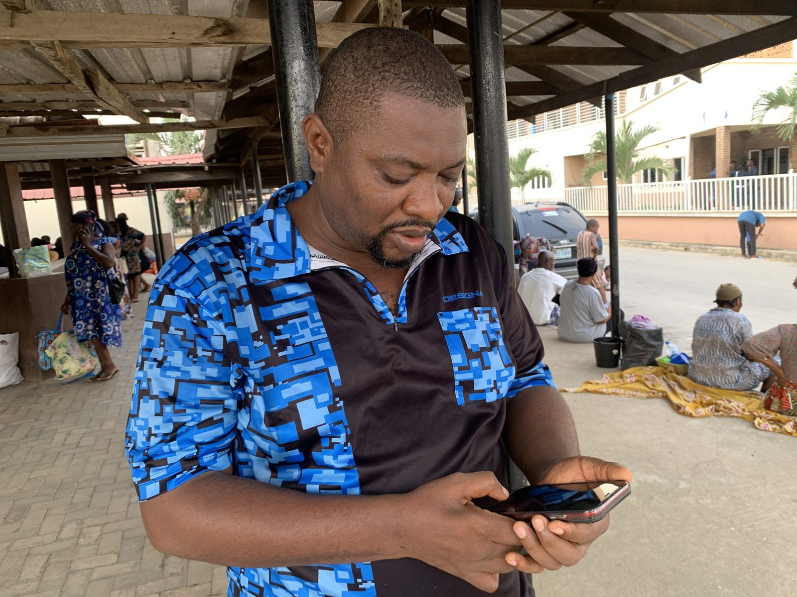 Chibueze Okoli, a father of one awaits his wife in the Alimosho General Hospital during their antenatal appointment (Photo credit_ Oluwakemi Adelagun-Olaoti)