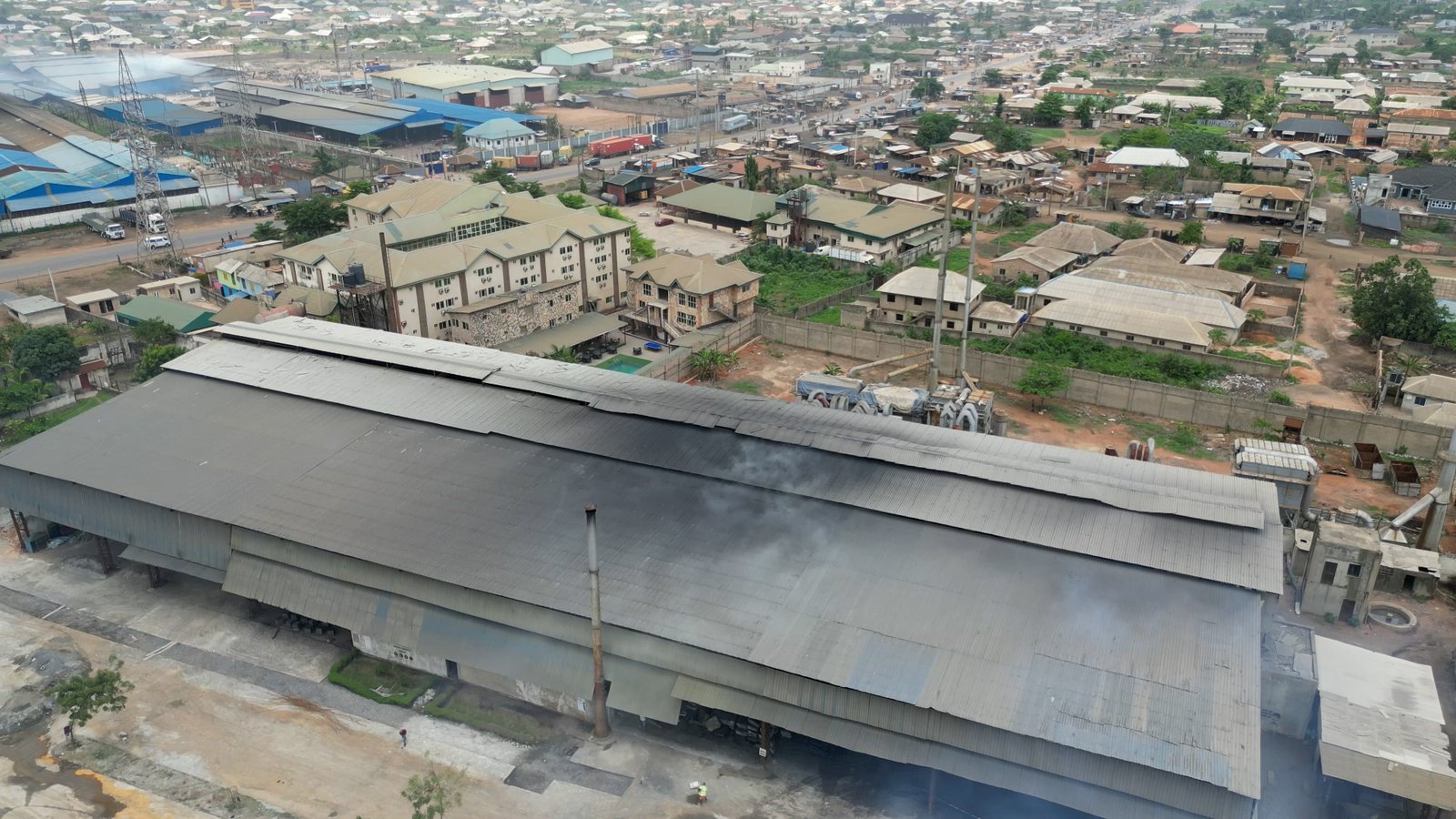 The auto industry touts the use of recycled lead in batteries as an environmental success story. But some of that lead comes from places like Ogijo, Nigeria, where toxic soot billows from crude factories and poisons workers and families. (PHOTO CREDIT: Finbarr O'Reilly for The New York Times)