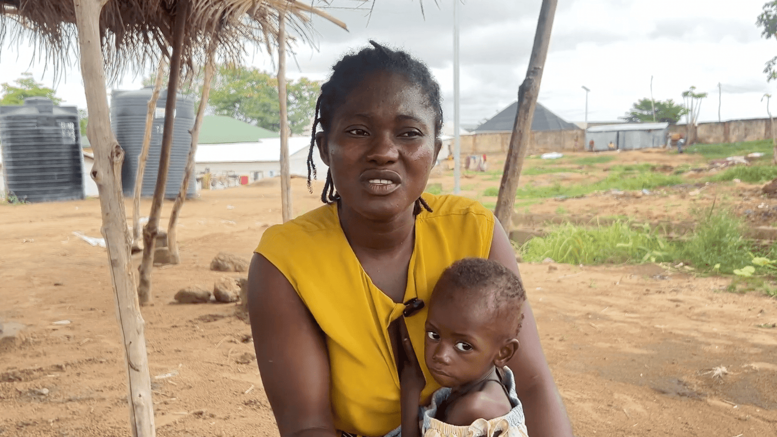 Margaret Kparmegh held her 17-months-old malnourished daughter. Photo_ Qosim Suleiman