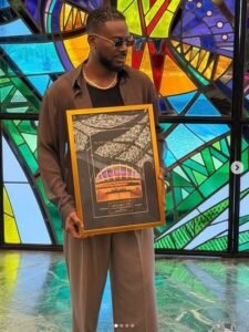 Adekunle Gold Receives Plaque For Becoming First Artiste To Sell Out Wole Soyinka Centre (Video) Adekunle Gold Receives Plaque For Becoming First Artiste To Sell Out Wole Soyinka Centre (Video)