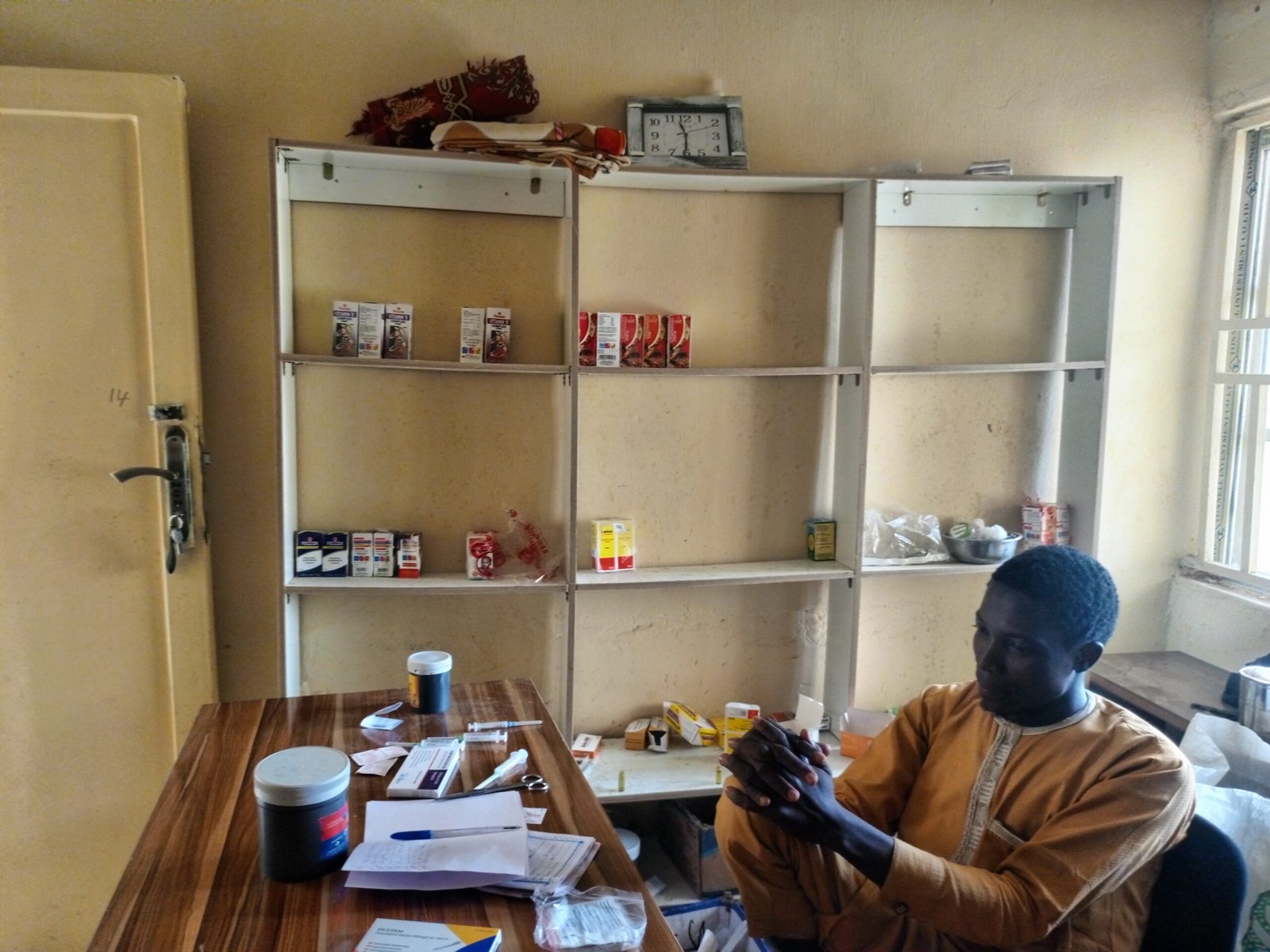 A volunteer staff member managing the drug/pharmacy unit at Dansarai PHC. (PHOTO CREDIT: Ogalah Dunamis)