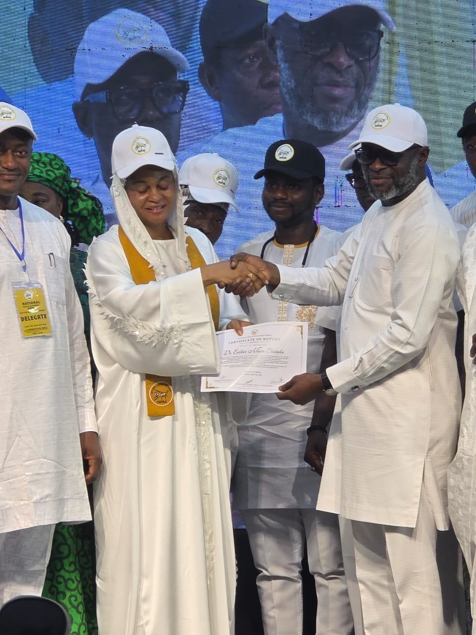 Actress Esther Okereke receives the party certificate