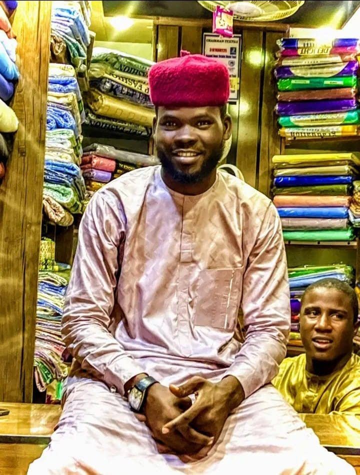Suleiman Hamza, Textile and Caps trader, working at Chairman Textile Shop.