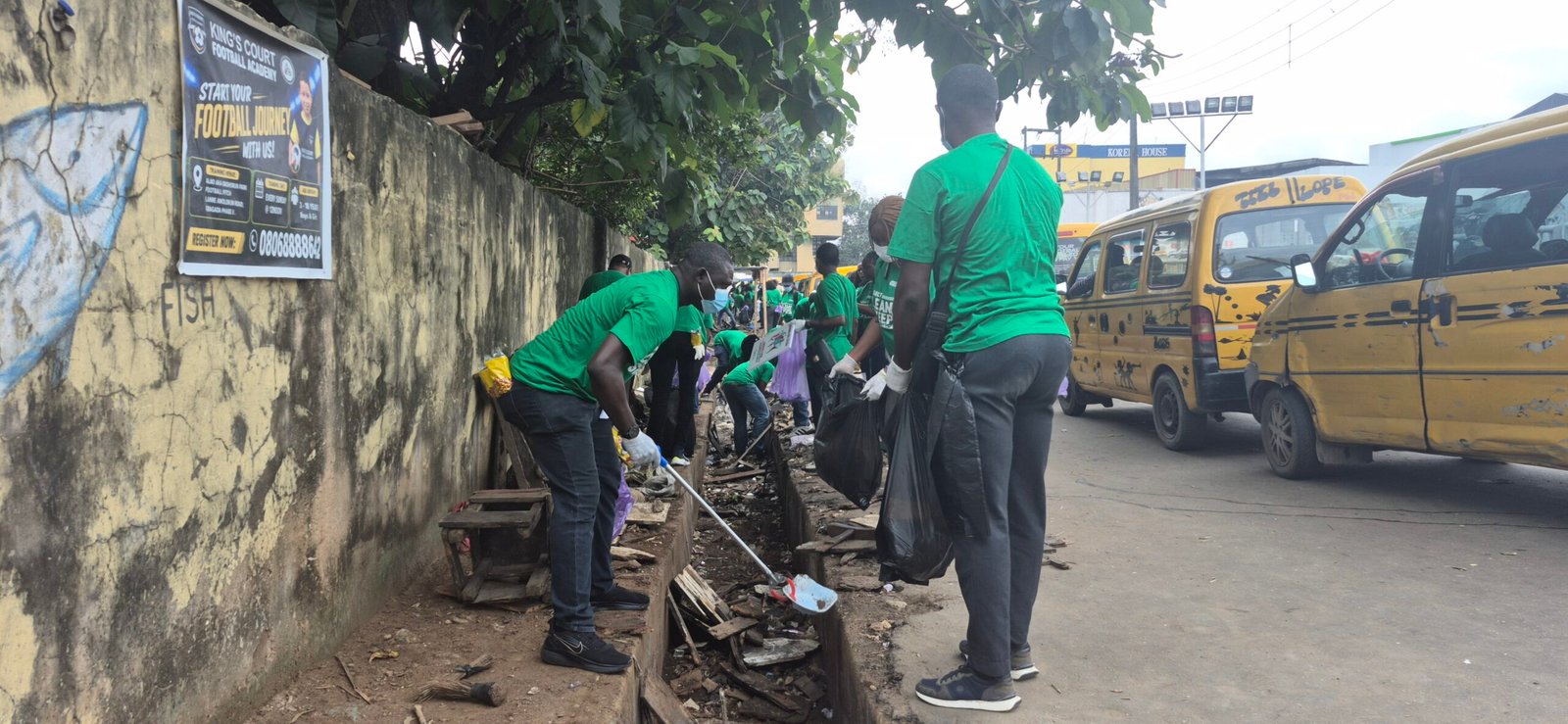 Volunteers take part in an environmental cleanup exercise organised by Fidson Healthcare in Lagos