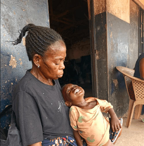 Anaor Saawuan and her grandson. Pic: Manasseh Mbachii/PREMIUM TIMES